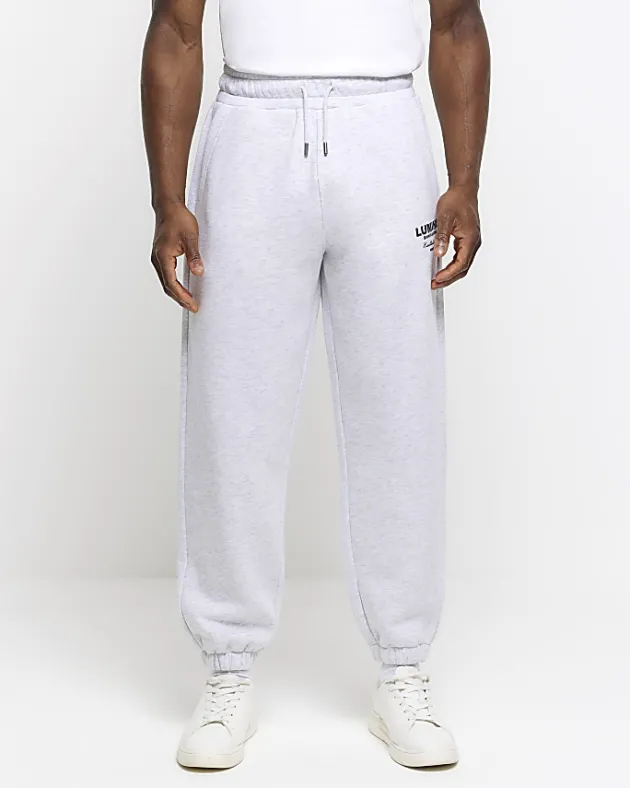 River Island regular fit graphic tracksuit joggers< Tracksuits